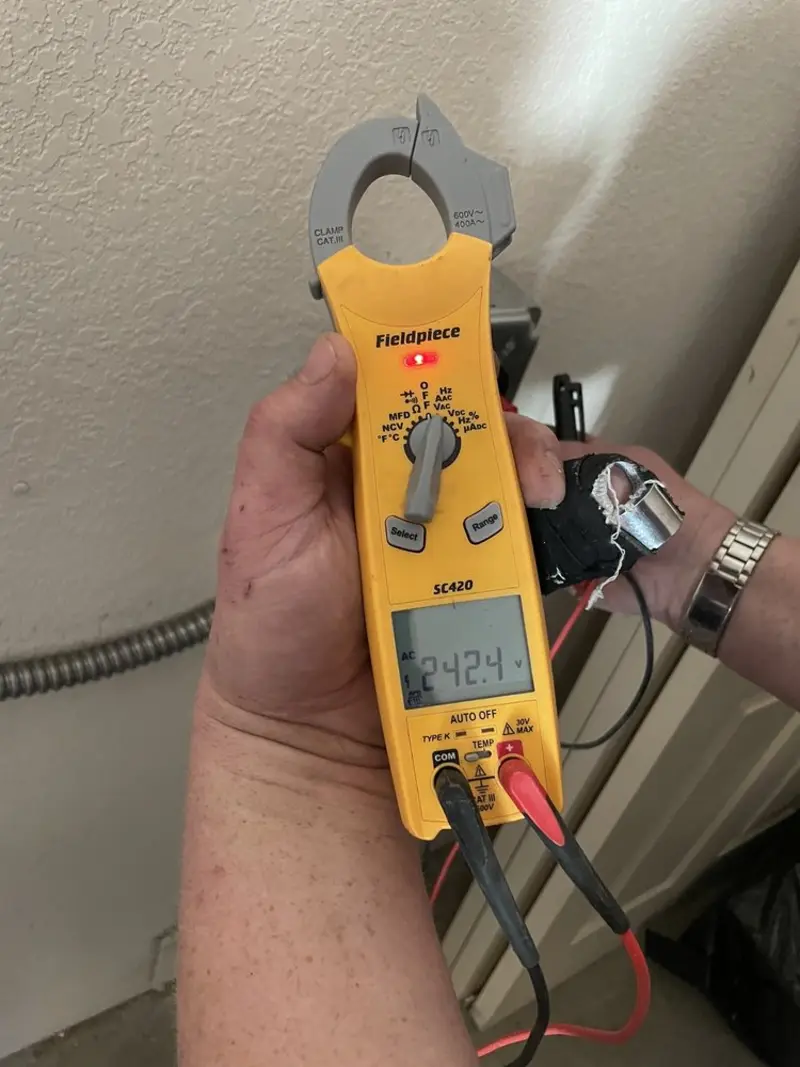 Voltage testing with clamp meter during Whole House Surge Protector in Northport